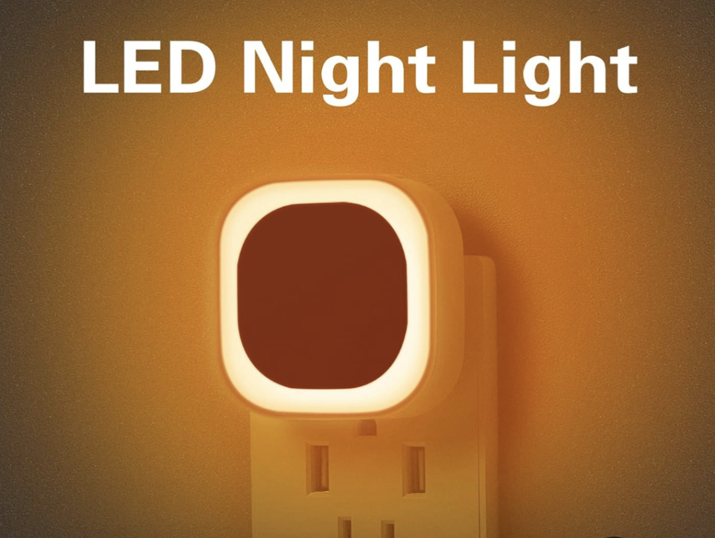 Warm amber LED night light plugged into a wall socket, a softly glowing Airawath home-wellness essential designed to support gentle wake-ups and calm morning rituals.